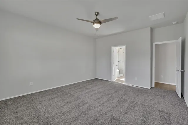 a bathroom with double vanity sinks and a mirror