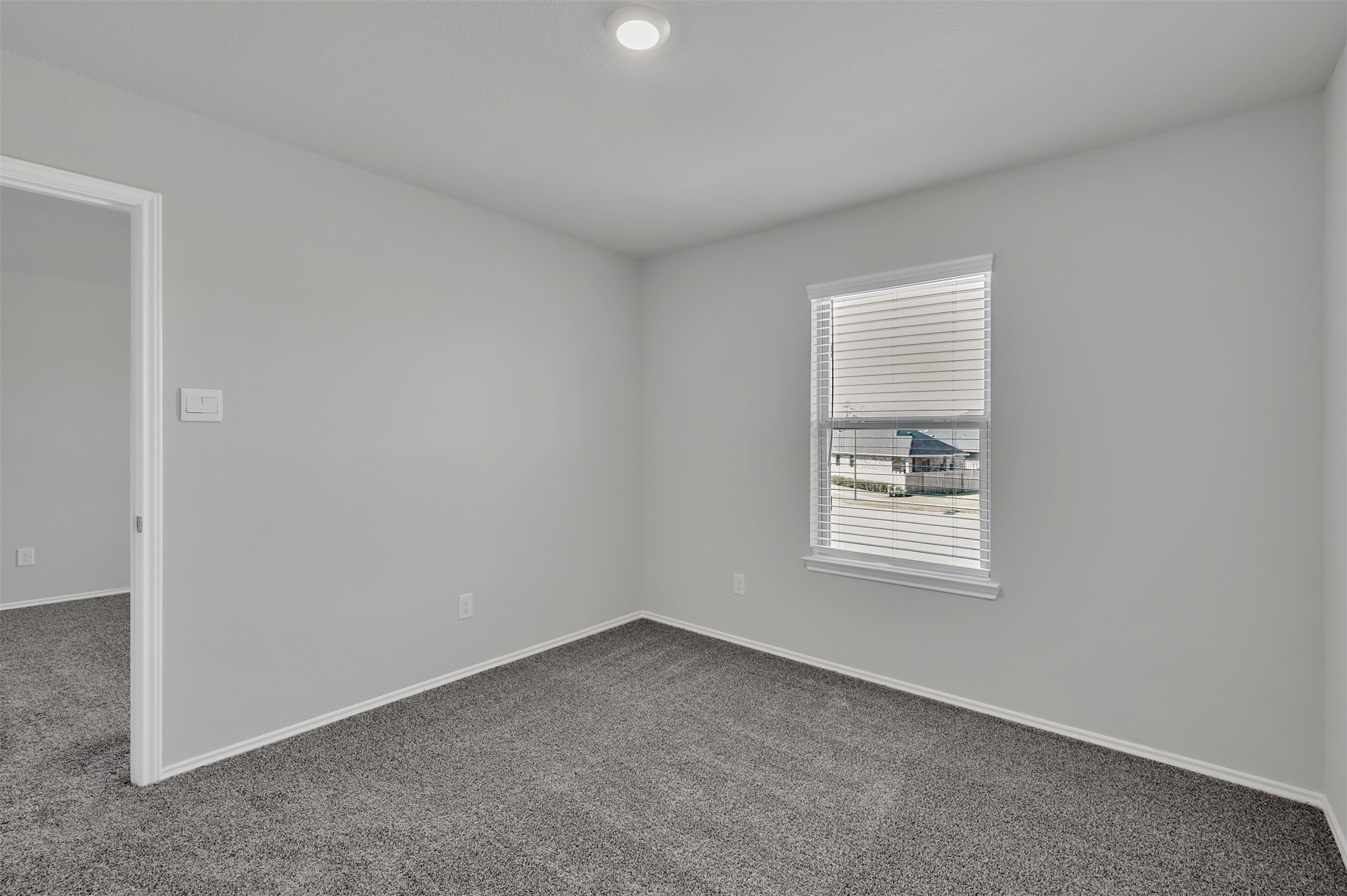 17105 Upland Bent Court Conroe, TX 77385 - Photo 24 of 40 an empty room with a window