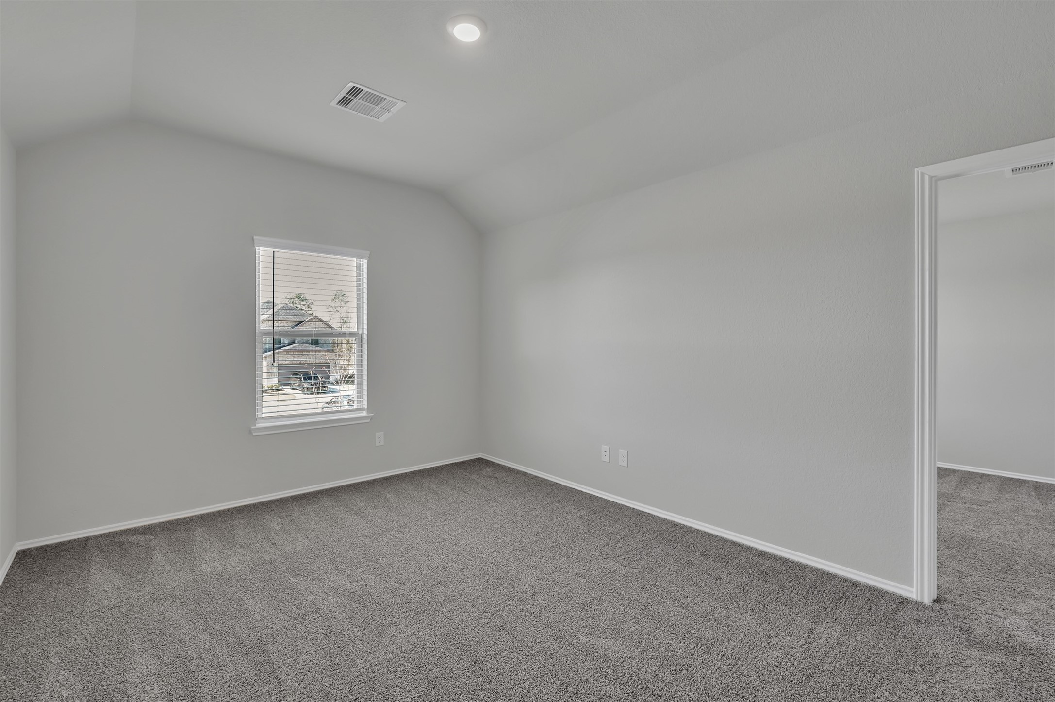 17105 Upland Bent Court Conroe, TX 77385 - Photo 27 of 40 an empty room with a window