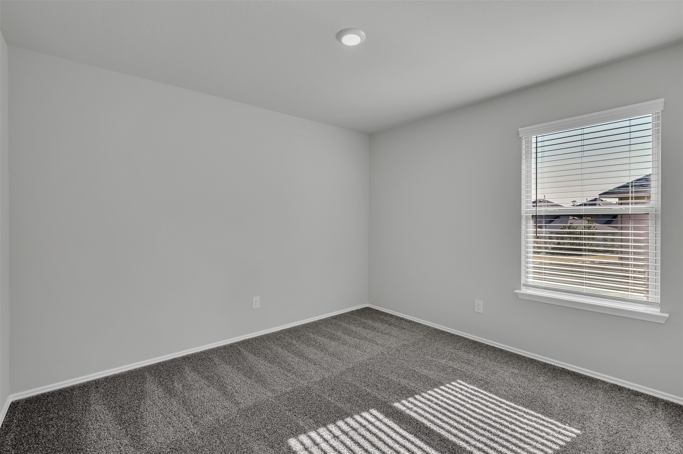 17105 Upland Bent Court Conroe, TX 77385 - Photo 28 of 40 an empty room with a window