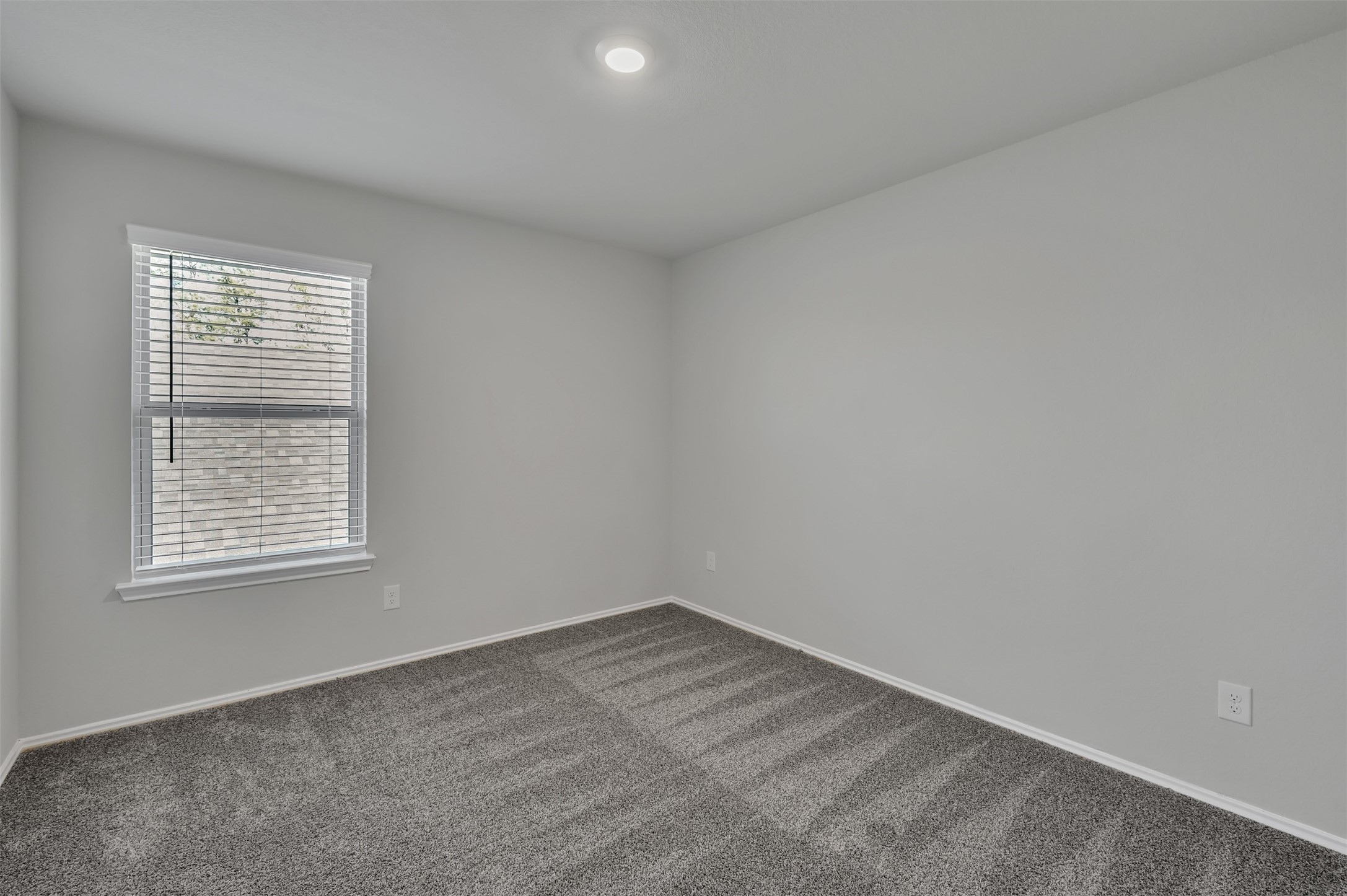 17105 Upland Bent Court Conroe, TX 77385 - Photo 32 of 40 an empty room with a window