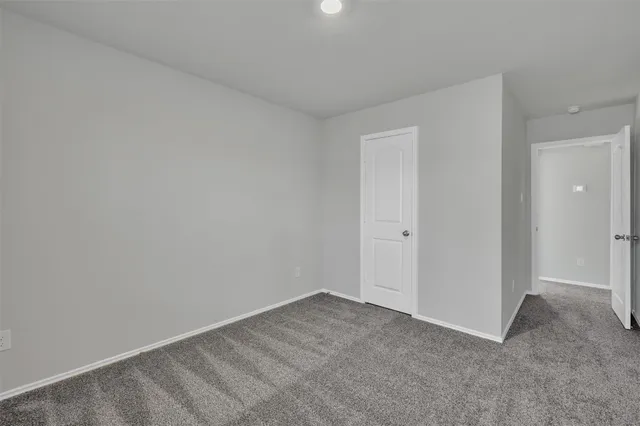 a view of staircase with white walls