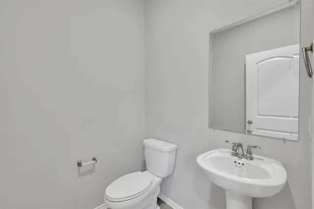 a large kitchen with stainless steel appliances granite countertop a lot of counter space and a window