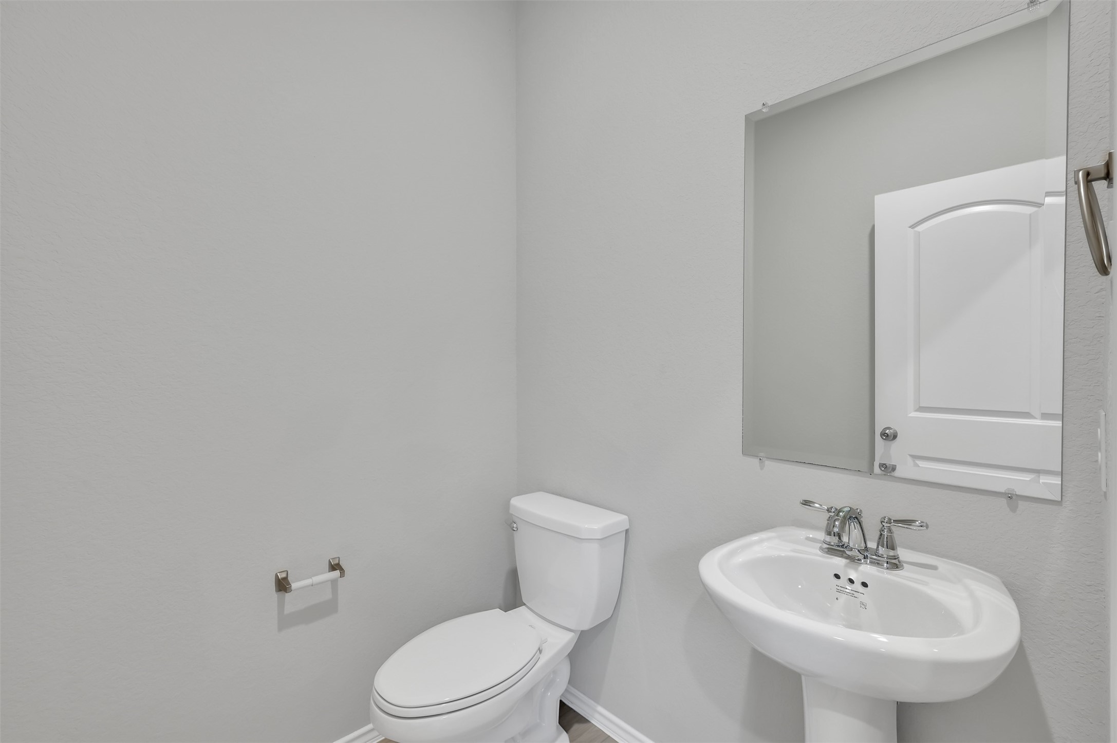 17105 Upland Bent Court Conroe, TX 77385 - Photo 7 of 40 a bathroom with a sink a toilet and a mirror