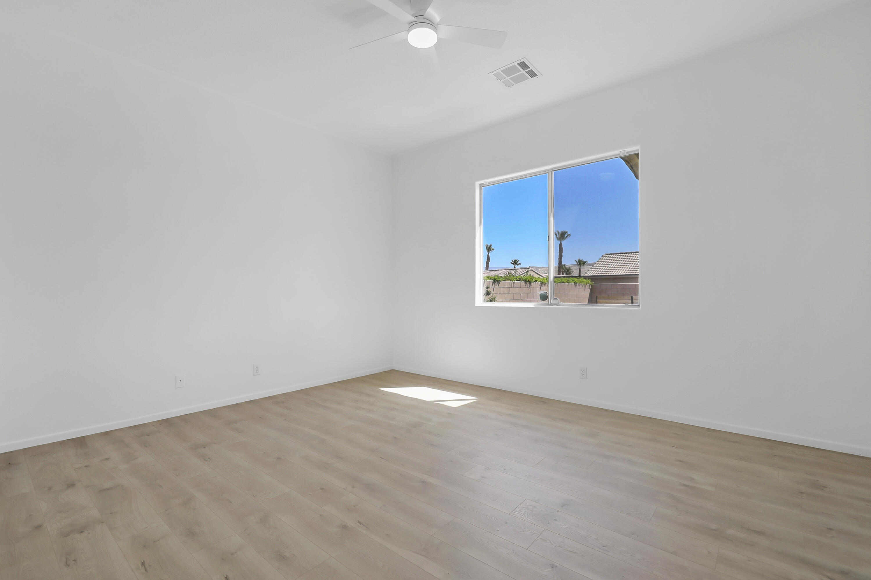 68256 Pasada Road Cathedral City, CA 92234 - Photo 17 of 35 a view of an empty room with a window