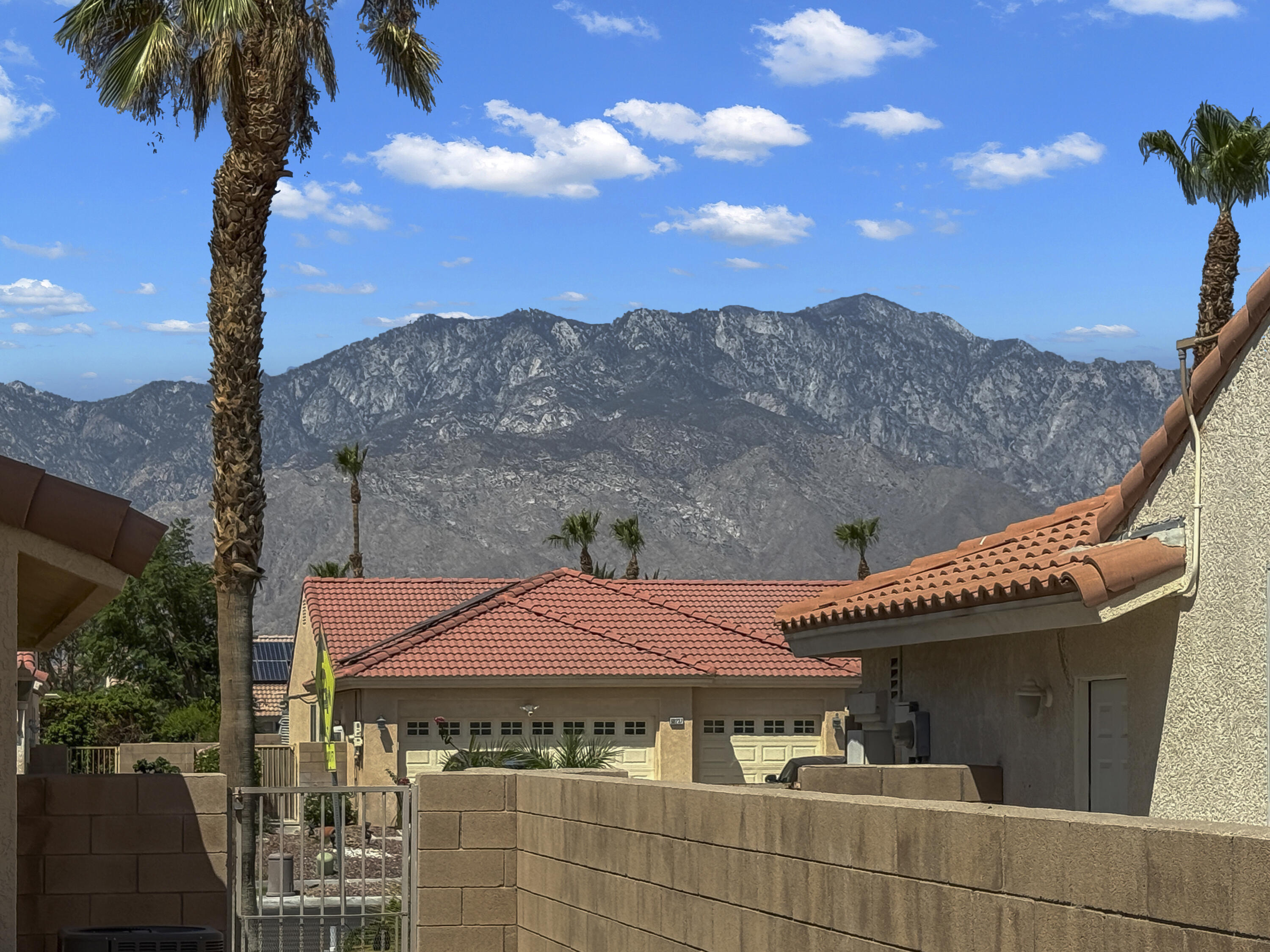 68256 Pasada Road Cathedral City, CA 92234 - Photo 30 of 35 a front view of a house with a mountain