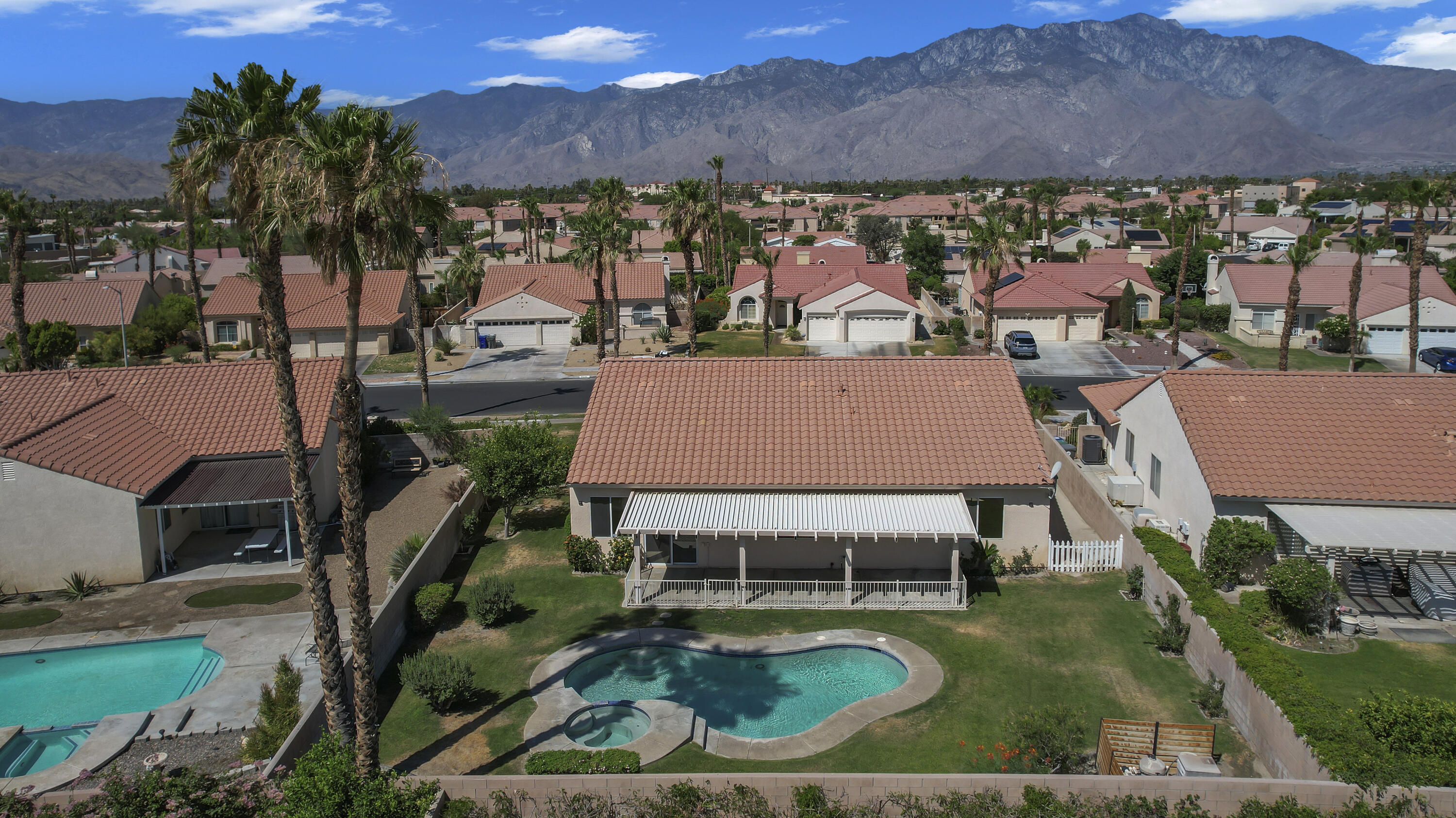 68256 Pasada Road Cathedral City, CA 92234 - Photo 34 of 35 an aerial view of a house with garden space and outdoor seating