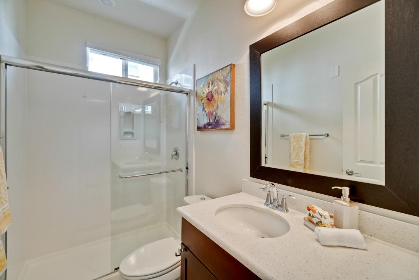1305 Merry Loop Milpitas, CA 95035 - Photo 14 of 30 a bathroom with a sink a toilet and shower