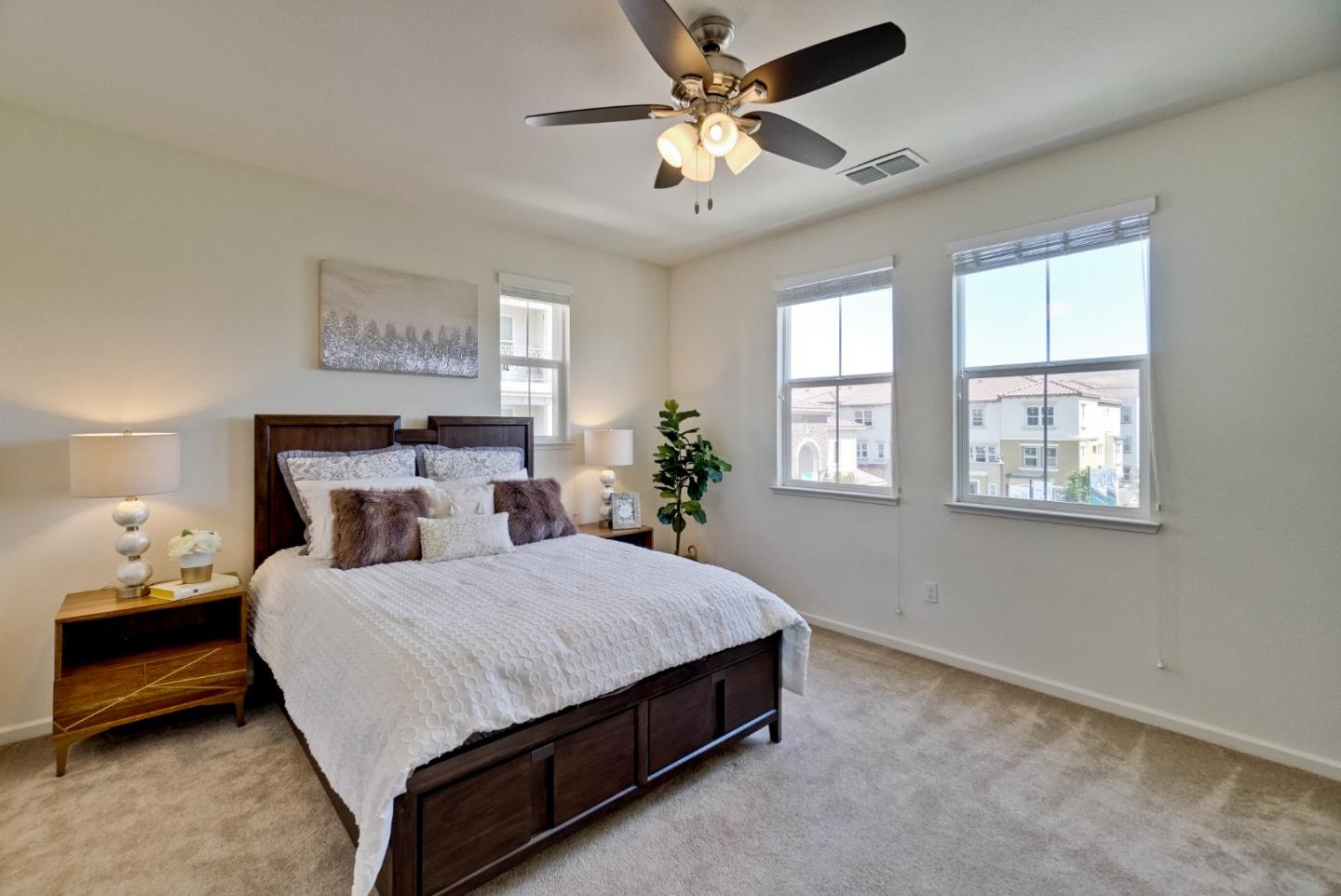 1305 Merry Loop Milpitas, CA 95035 - Photo 16 of 30 a bedroom with a bed and a chandelier