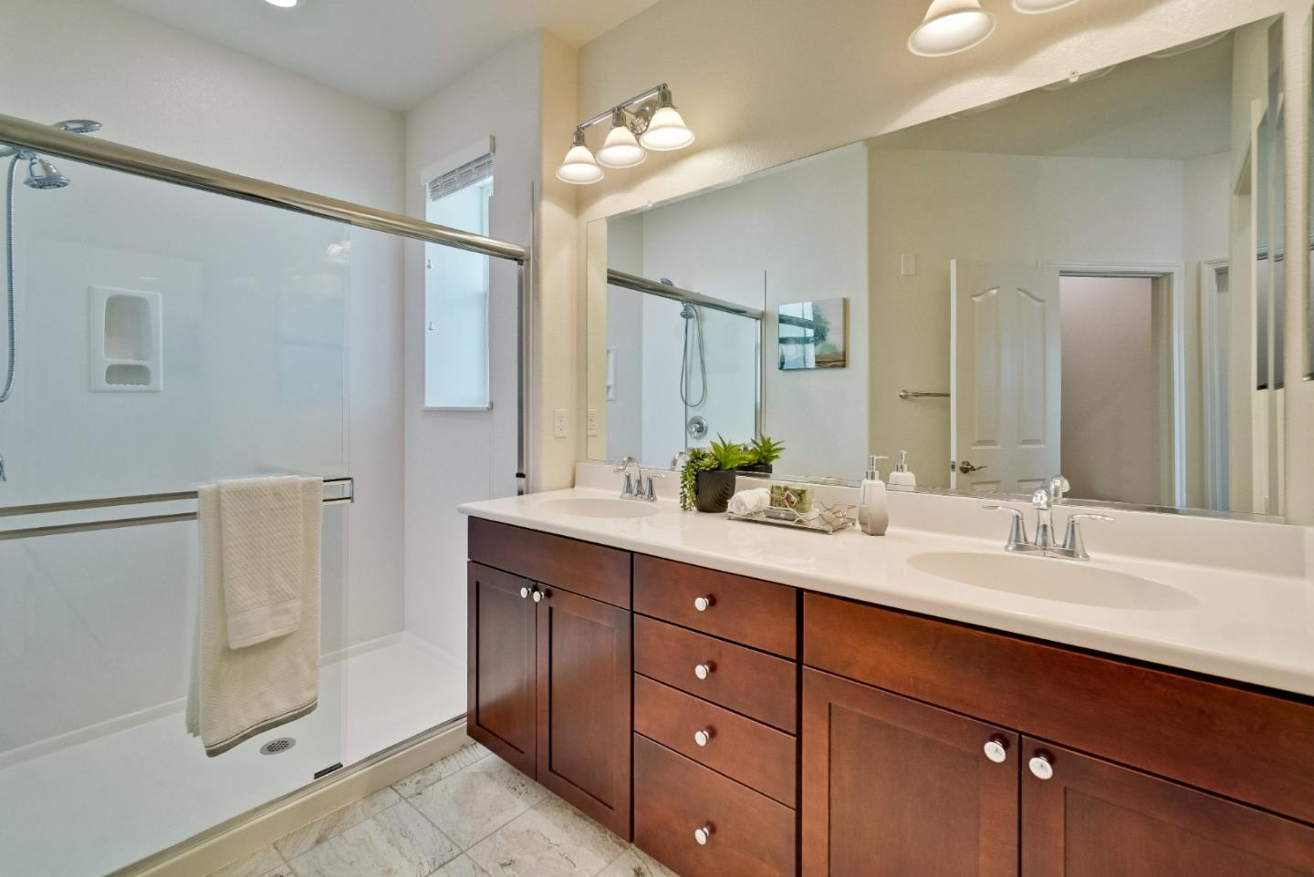 1305 Merry Loop Milpitas, CA 95035 - Photo 17 of 30 a bathroom with double vanity sink and a mirror