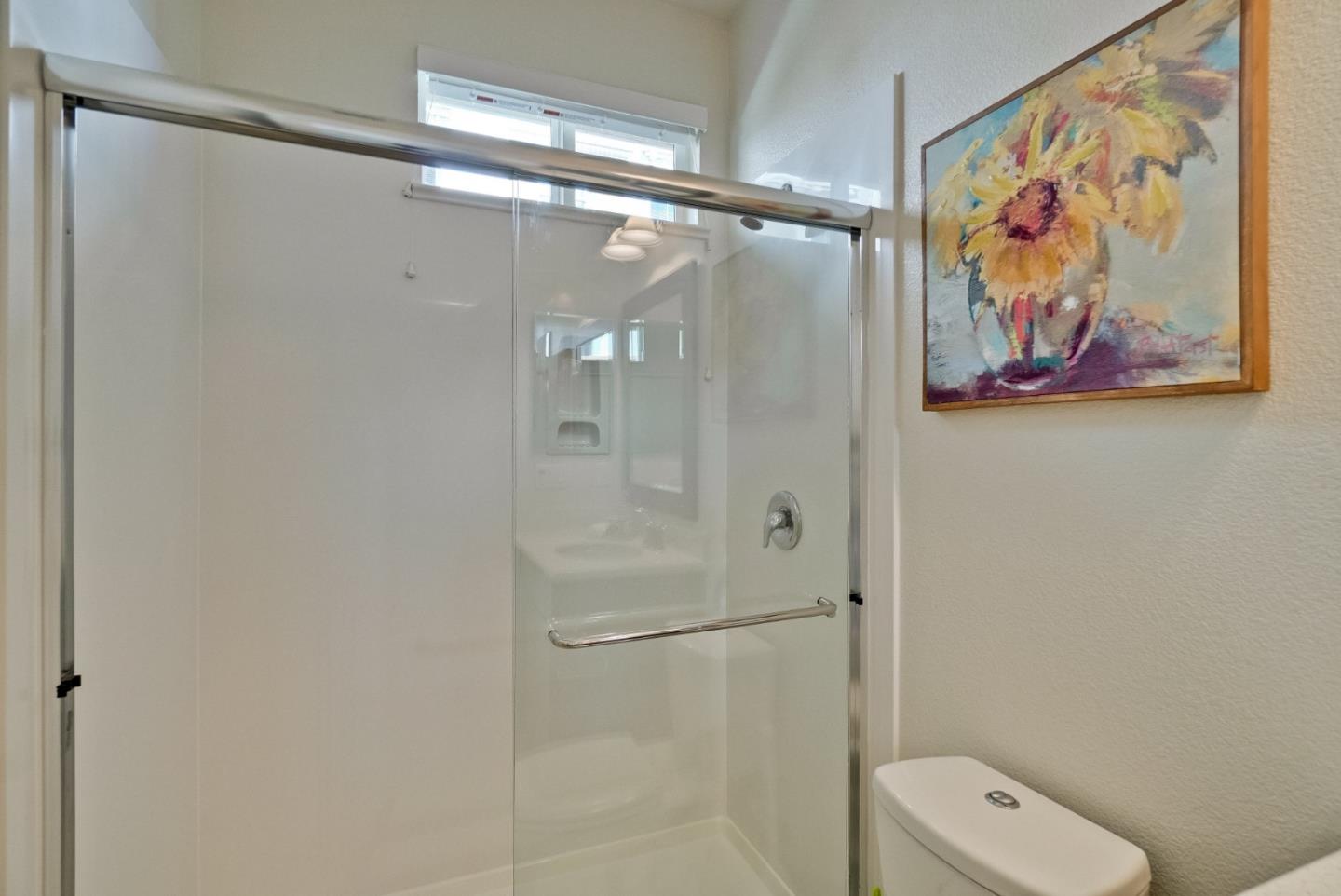 1305 Merry Loop Milpitas, CA 95035 - Photo 21 of 30 a bathroom with a painting on the wall and shower