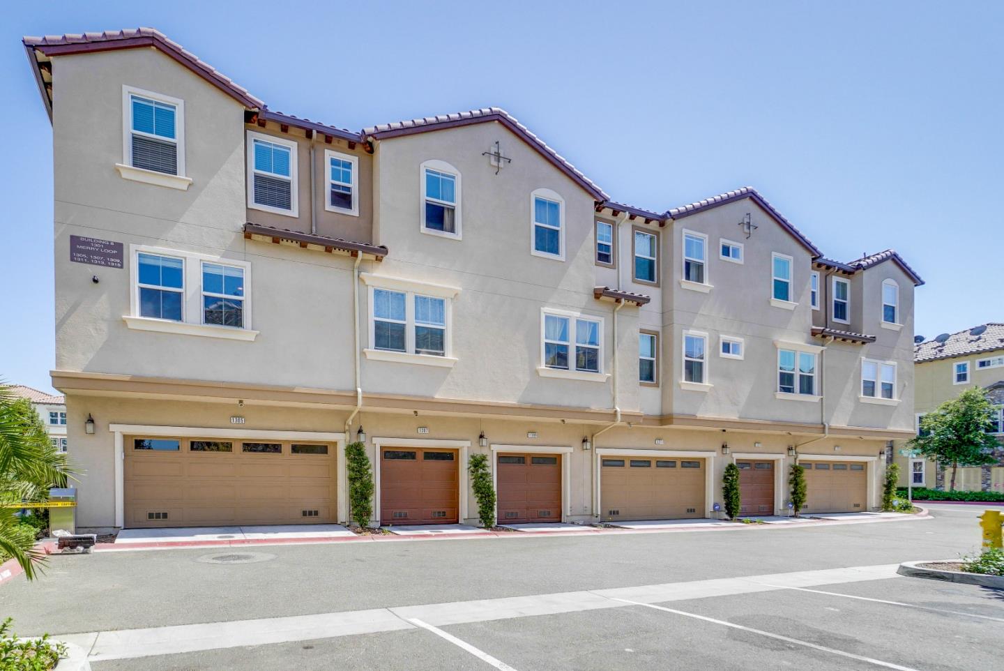 1305 Merry Loop Milpitas, CA 95035 - Photo 23 of 30 a front view of a building with a road
