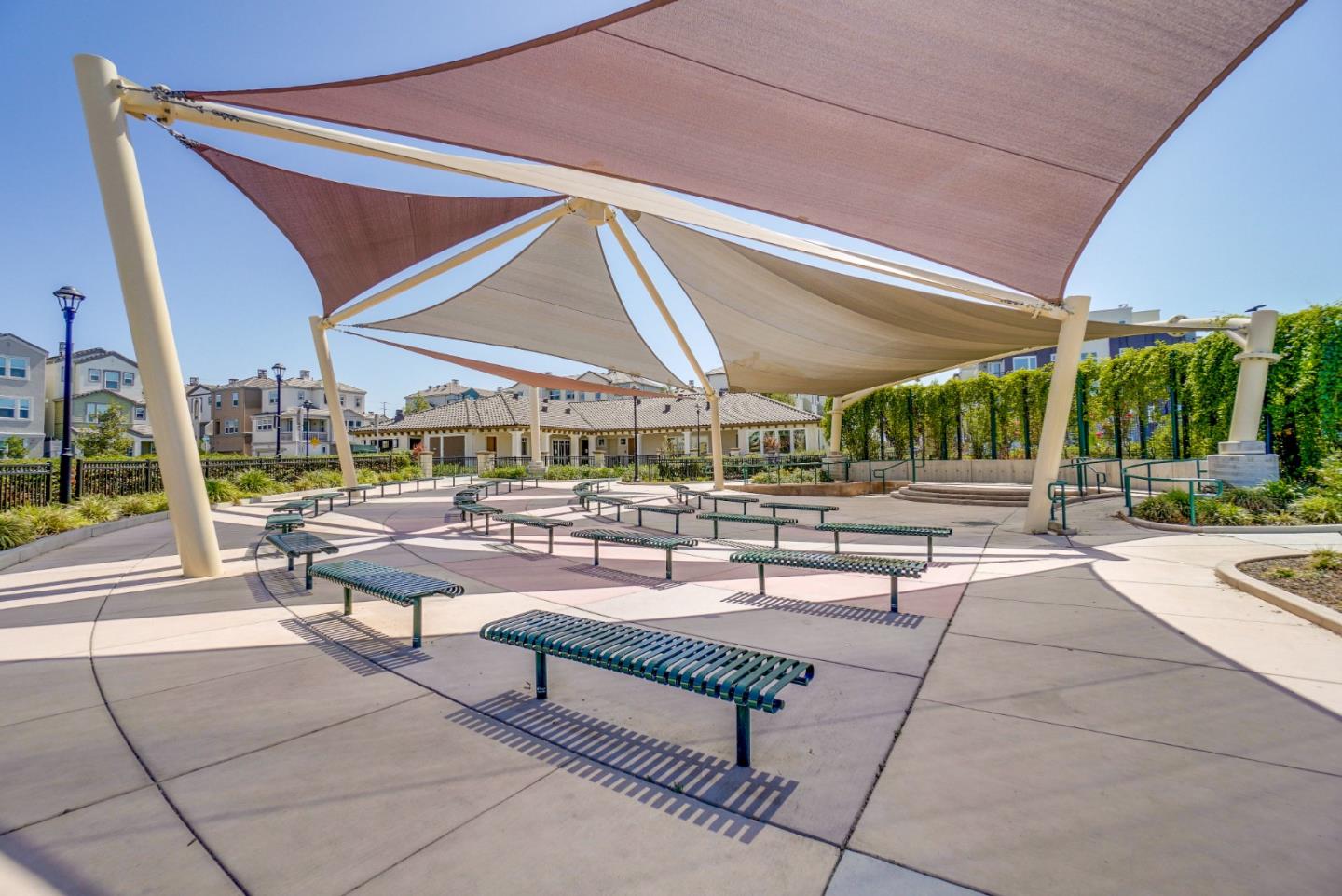 1305 Merry Loop Milpitas, CA 95035 - Photo 27 of 30 a roof deck with a table and chairs under an umbrella