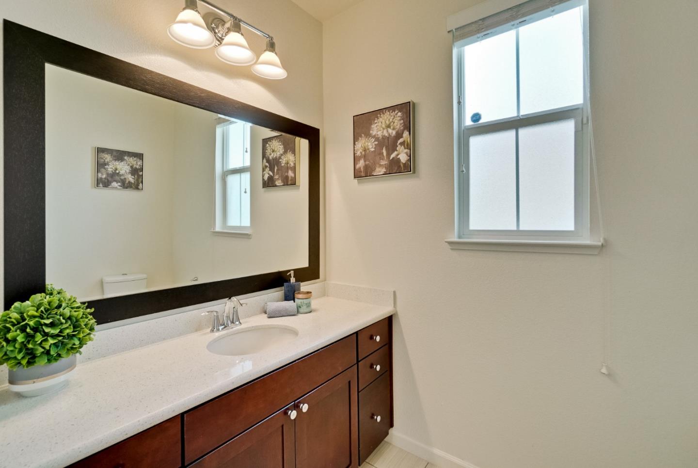1305 Merry Loop Milpitas, CA 95035 - Photo 4 of 30 a bathroom with a sink and a mirror