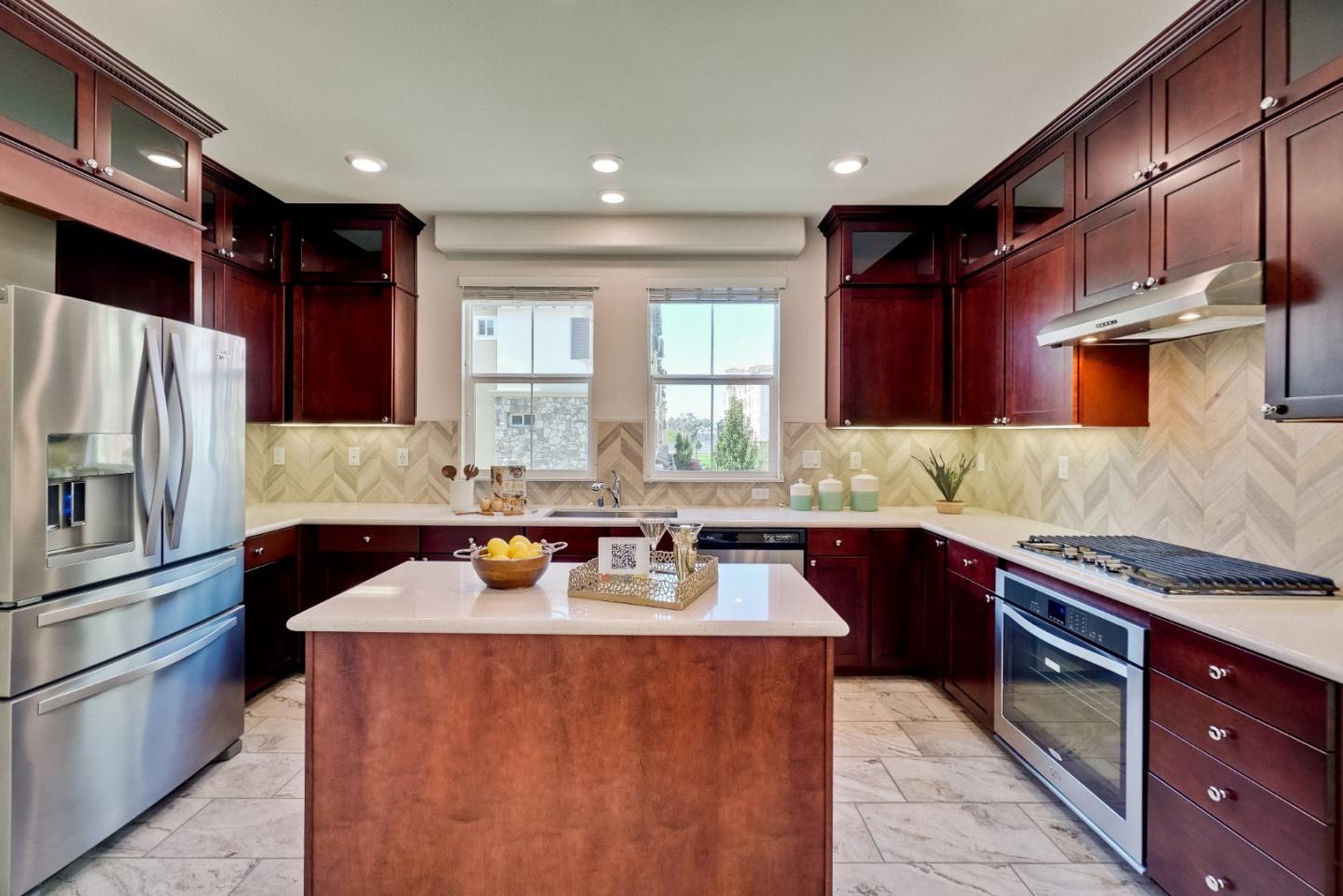 1305 Merry Loop Milpitas, CA 95035 - Photo 5 of 30 a kitchen with stainless steel appliances granite countertop a sink stove and refrigerator
