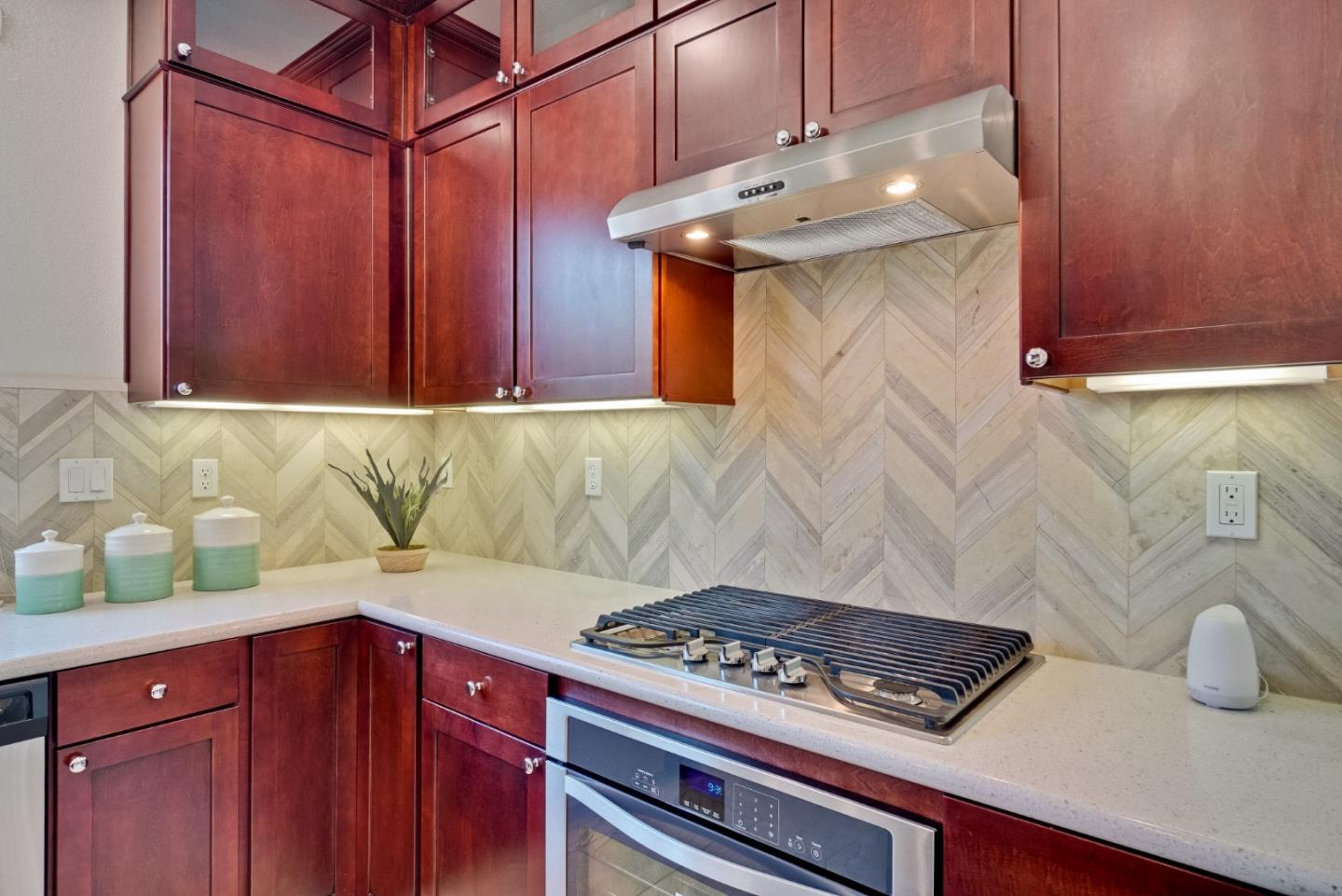 1305 Merry Loop Milpitas, CA 95035 - Photo 8 of 30 a kitchen with a stove and cabinets