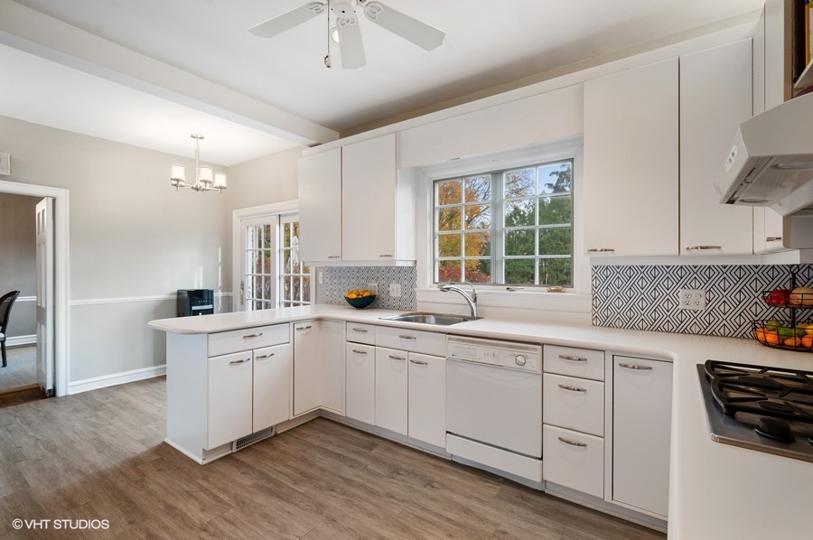 375 Sterling Road Kenilworth, IL 60043 - Photo 12 of 28 a kitchen with sink stove and cabinets