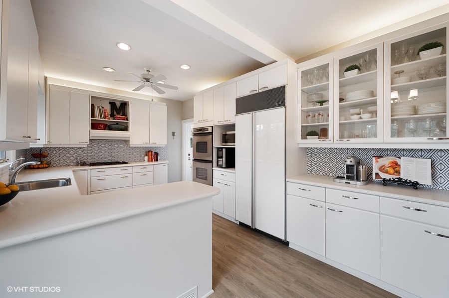 375 Sterling Road Kenilworth, IL 60043 - Photo 13 of 28 a kitchen with stainless steel appliances a refrigerator sink and cabinets