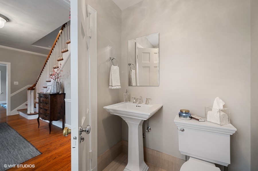 375 Sterling Road Kenilworth, IL 60043 - Photo 15 of 28 a bathroom with a sink a toilet and a mirror