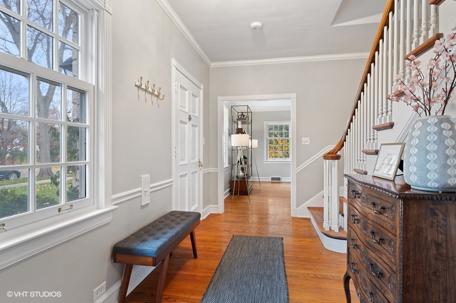 375 Sterling Road Kenilworth, IL 60043 - Photo 3 of 28 a view of a hallway with wooden floor and staircase