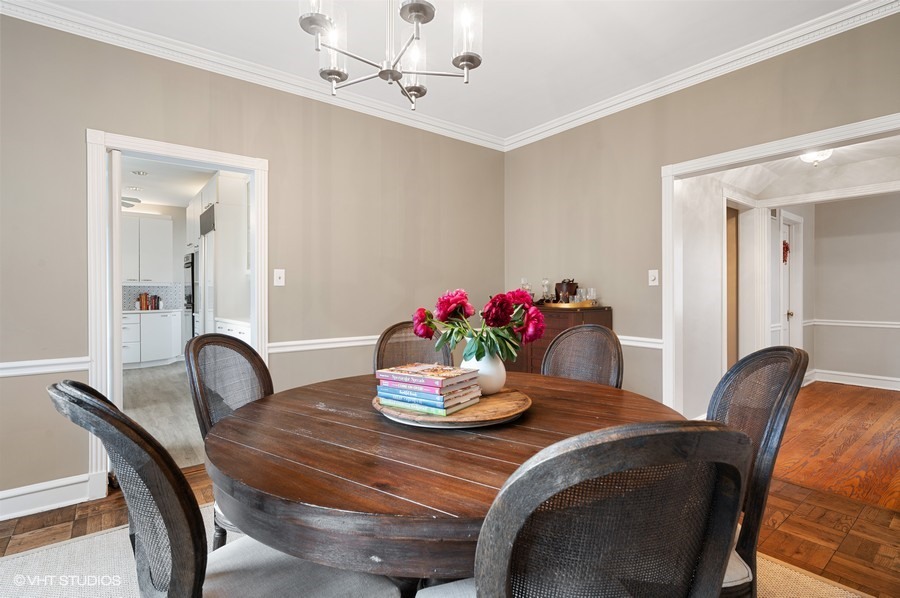 375 Sterling Road Kenilworth, IL 60043 - Photo 9 of 28 a dining room with furniture and potted plant