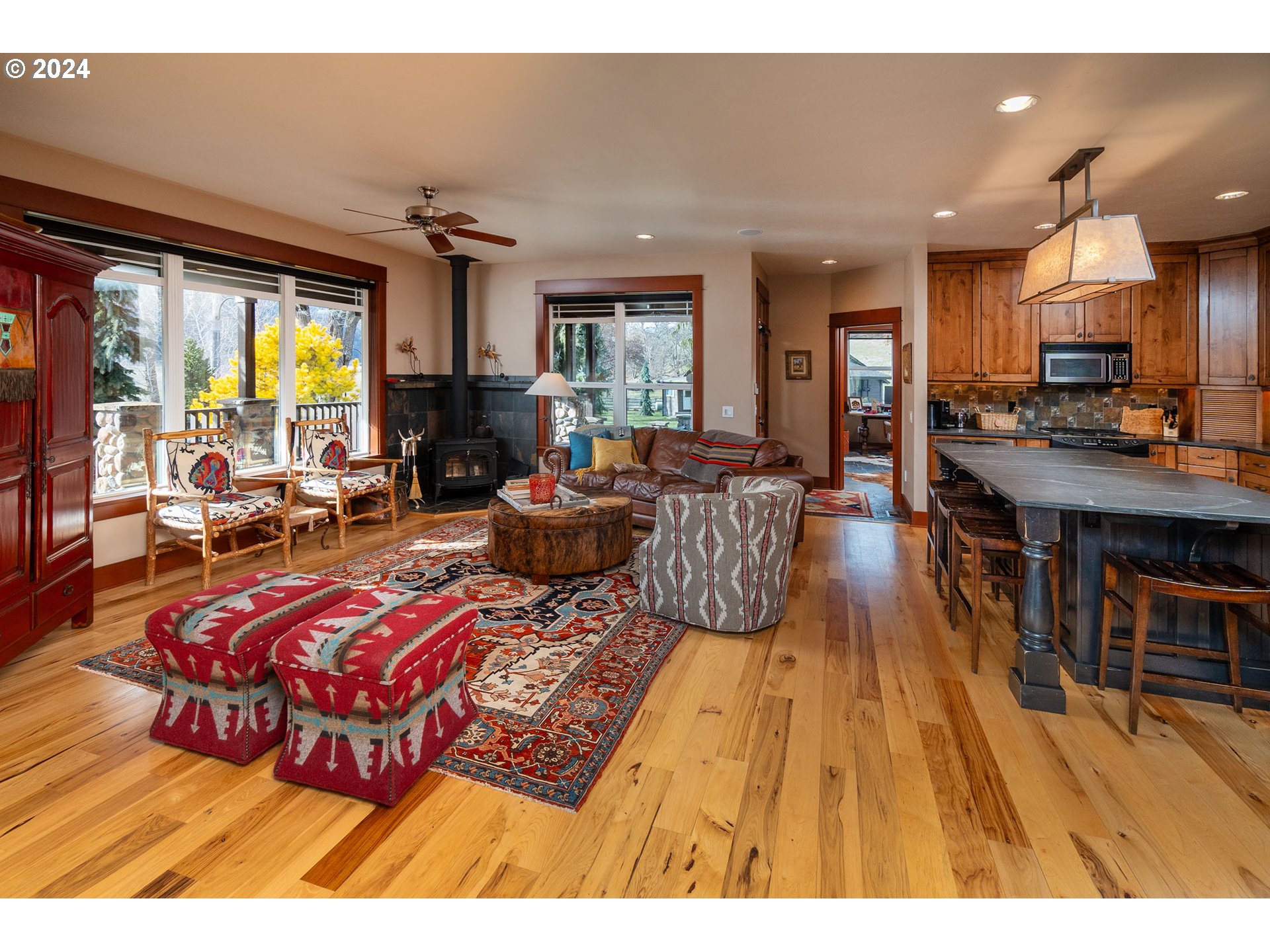 6100 Eightmile Road The Dalles, OR 97058 - Photo 13 of 44 a living room with furniture a large window and a table