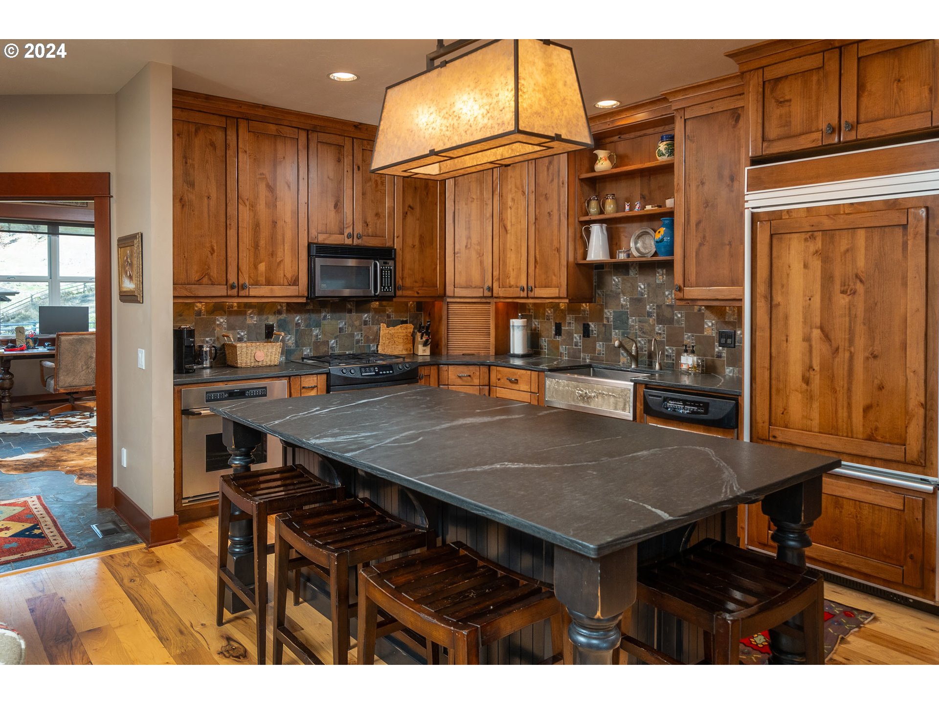 6100 Eightmile Road The Dalles, OR 97058 - Photo 15 of 44 a open kitchen with stainless steel appliances dining table and chairs