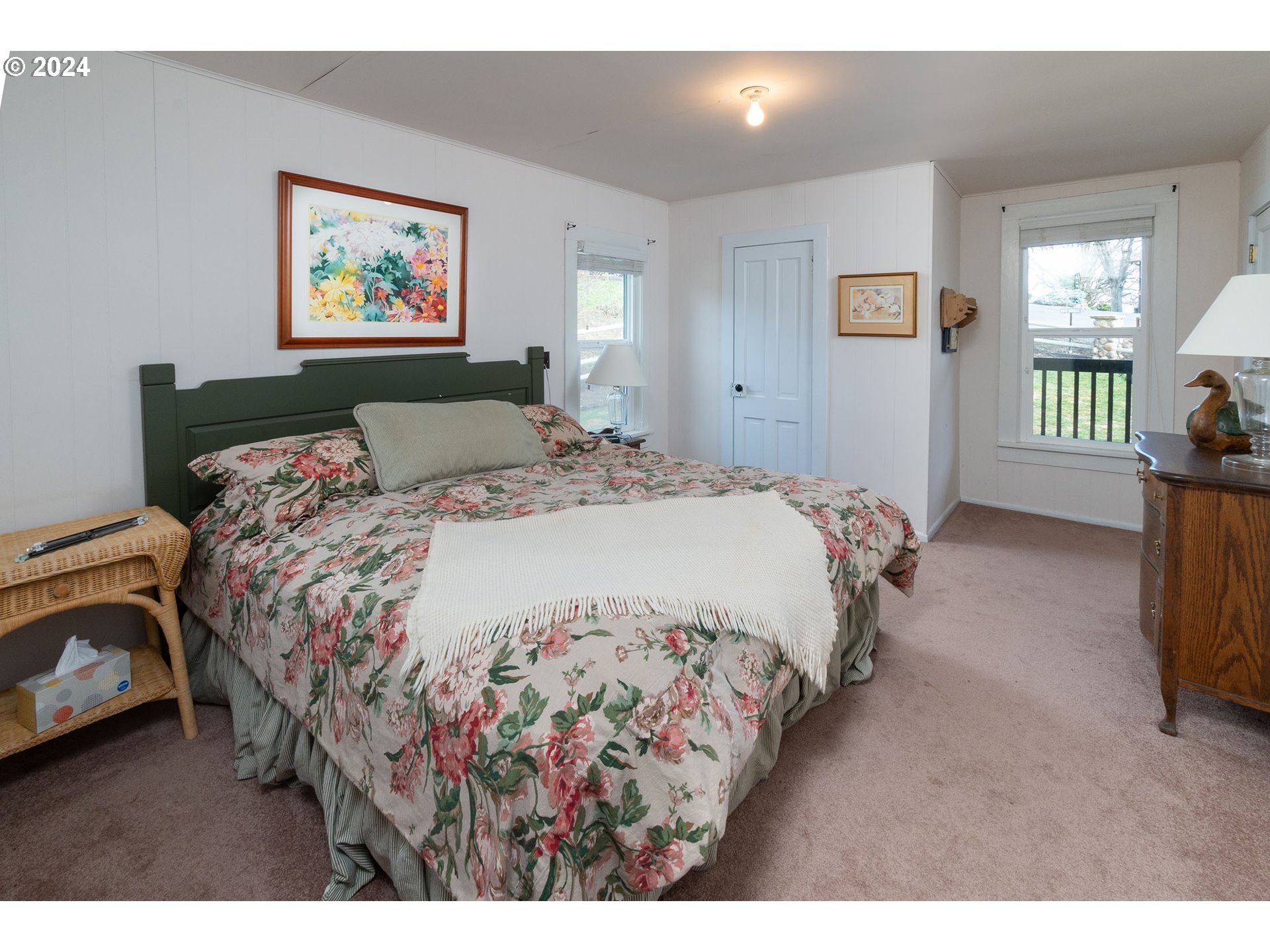 6100 Eightmile Road The Dalles, OR 97058 - Photo 19 of 44 a bedroom with a bed and a painting on the wall