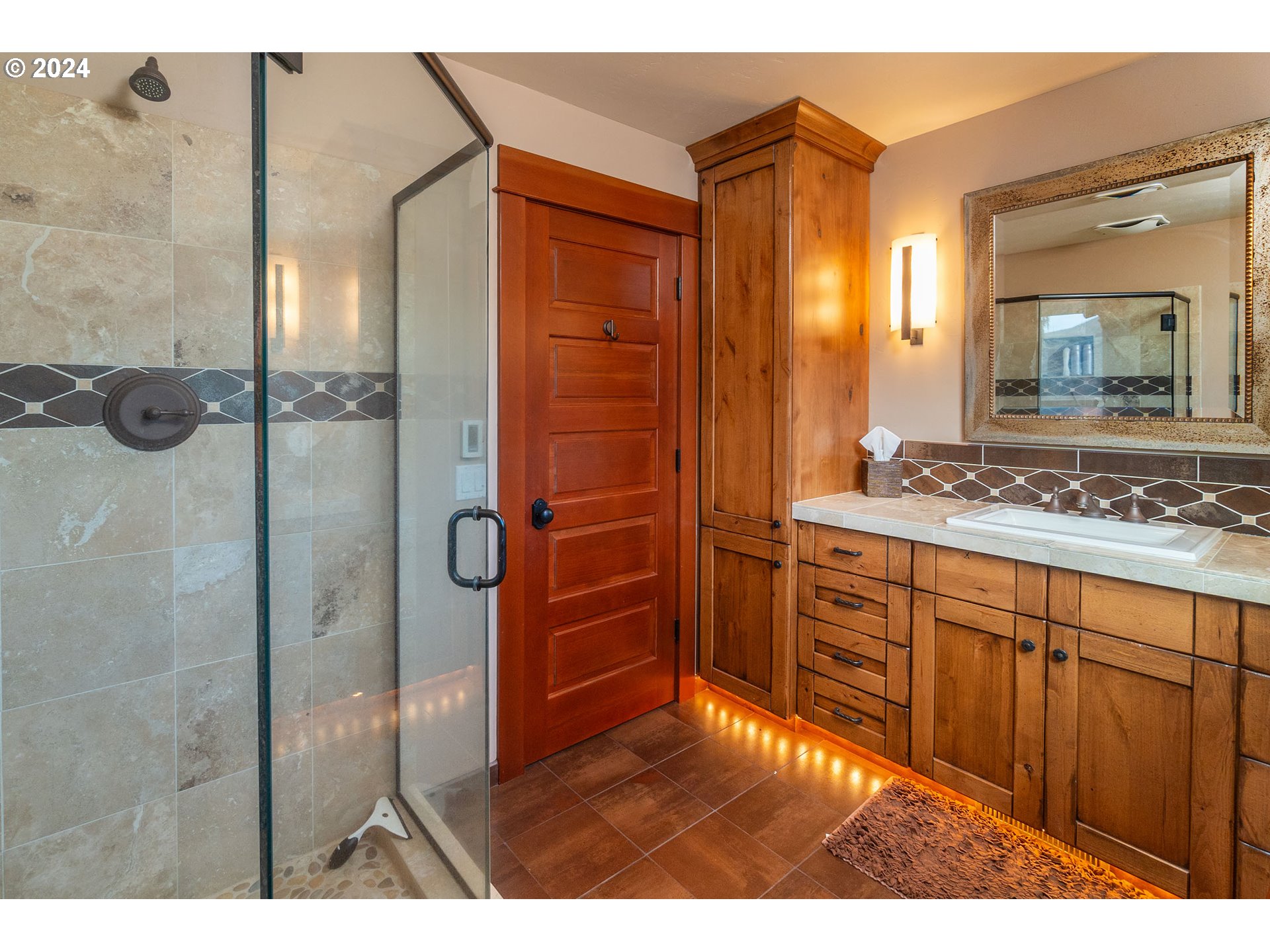6100 Eightmile Road The Dalles, OR 97058 - Photo 22 of 44 a bathroom with a granite countertop sink a mirror and a shower