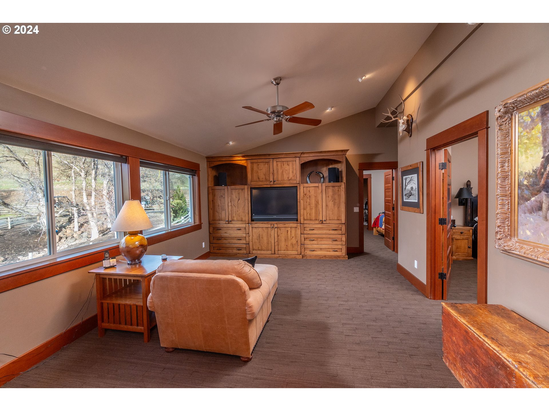 6100 Eightmile Road The Dalles, OR 97058 - Photo 28 of 44 a living room with furniture a flat screen tv and a large window