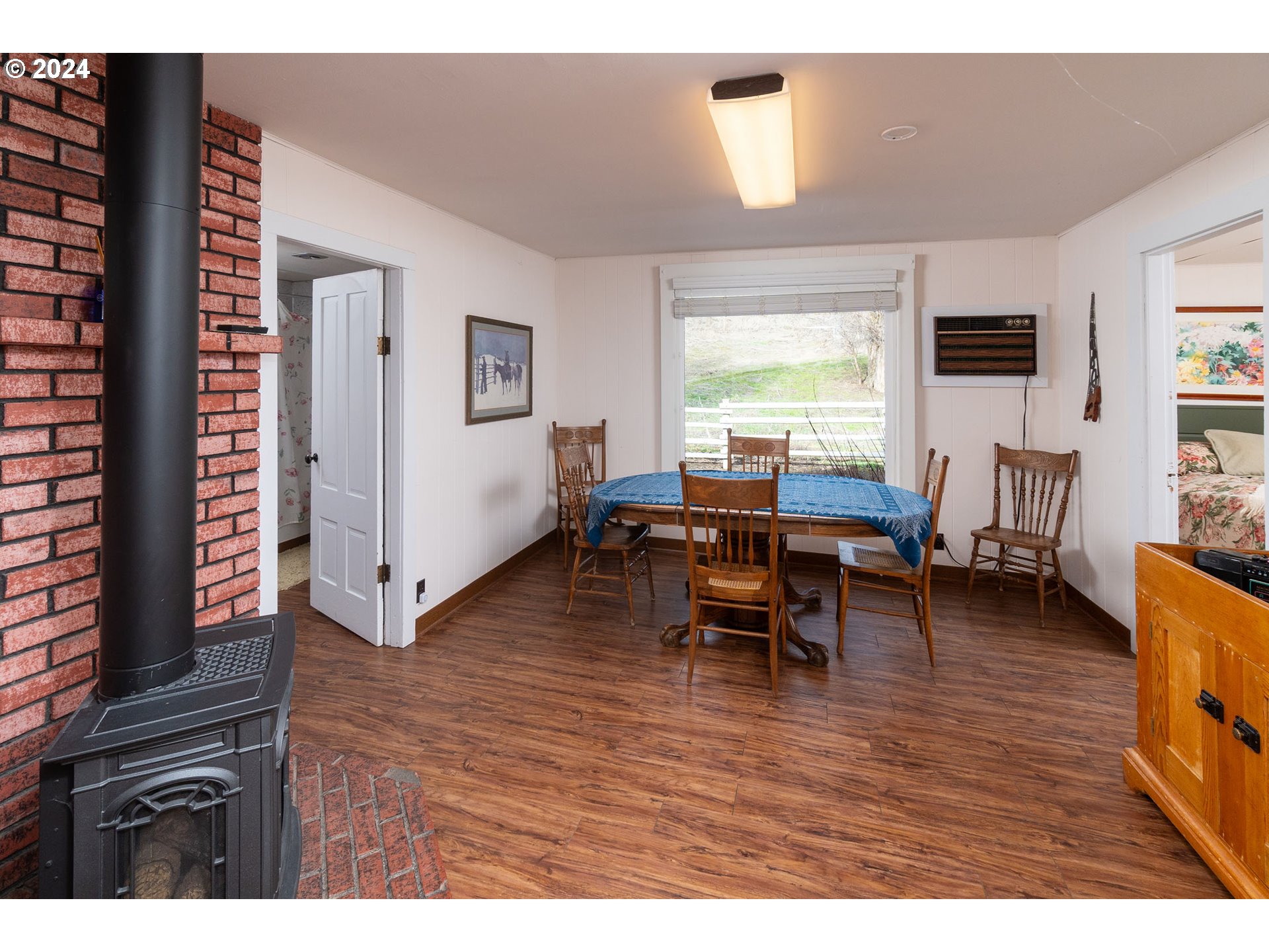 6100 Eightmile Road The Dalles, OR 97058 - Photo 29 of 44 a living room with furniture and a wooden floor