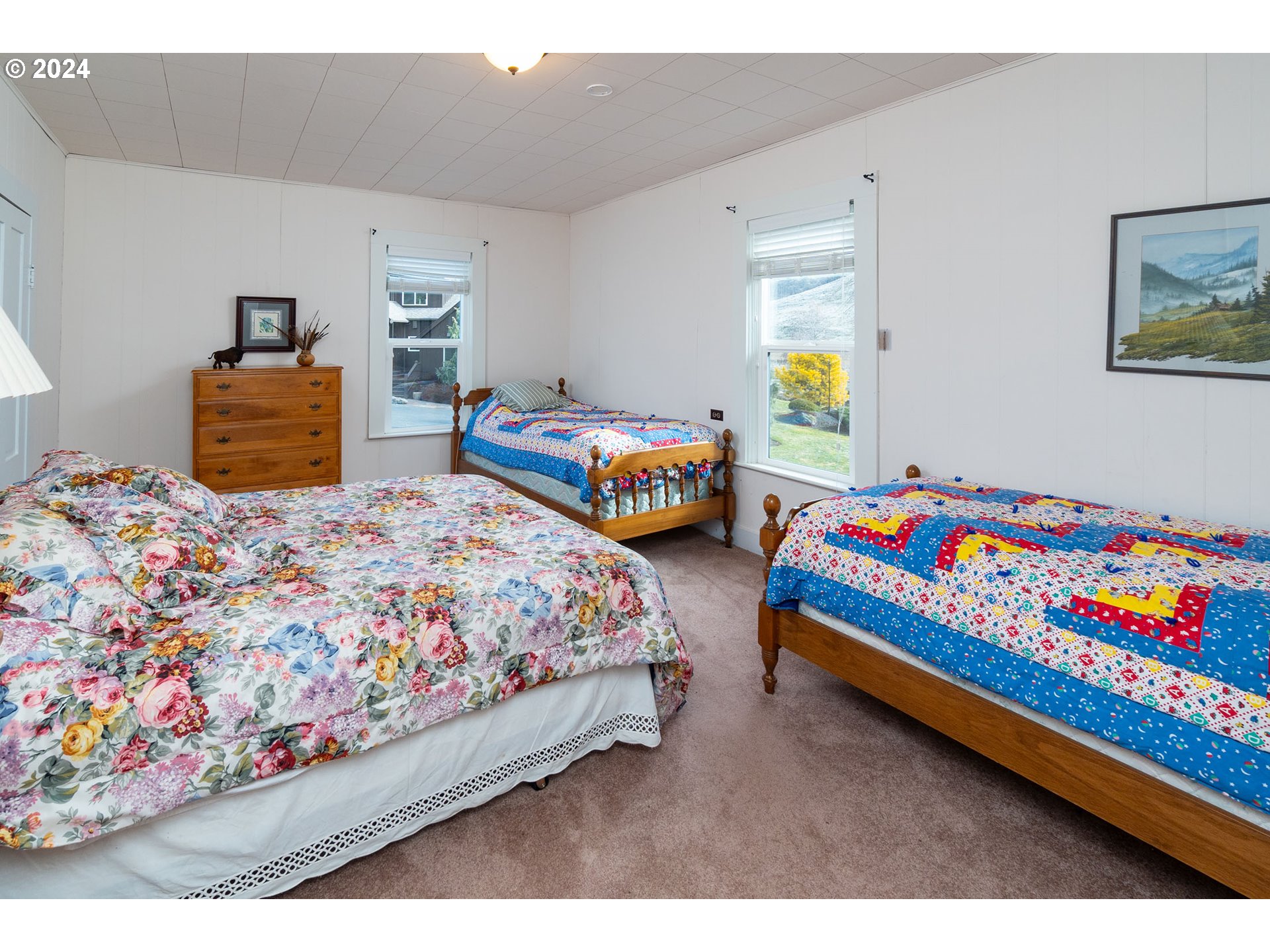 6100 Eightmile Road The Dalles, OR 97058 - Photo 30 of 44 a bedroom with two beds and painting on the wall