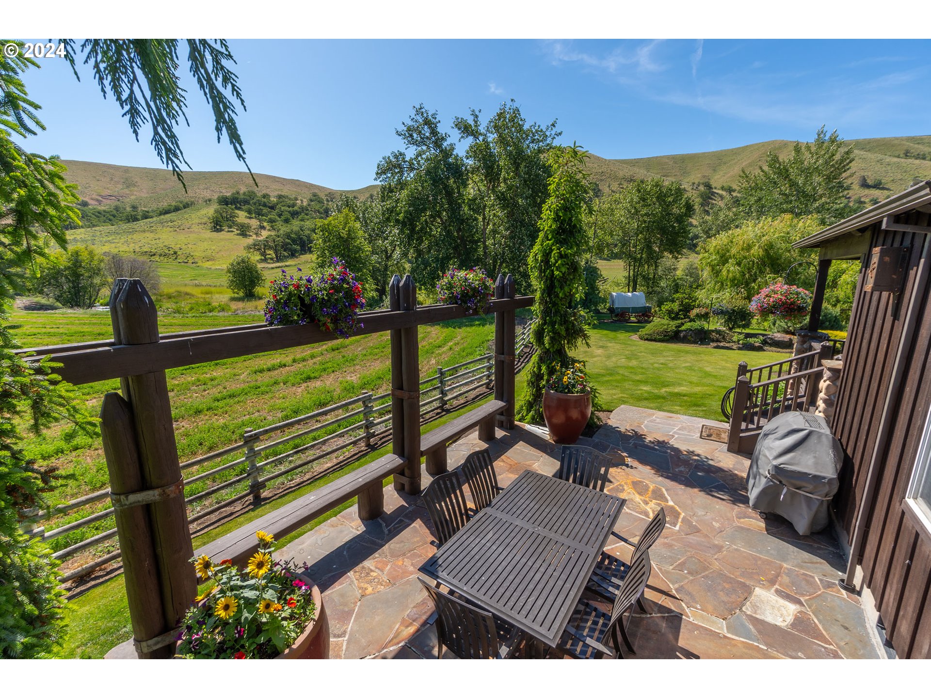 6100 Eightmile Road The Dalles, OR 97058 - Photo 38 of 44 a view of a yard with furniture