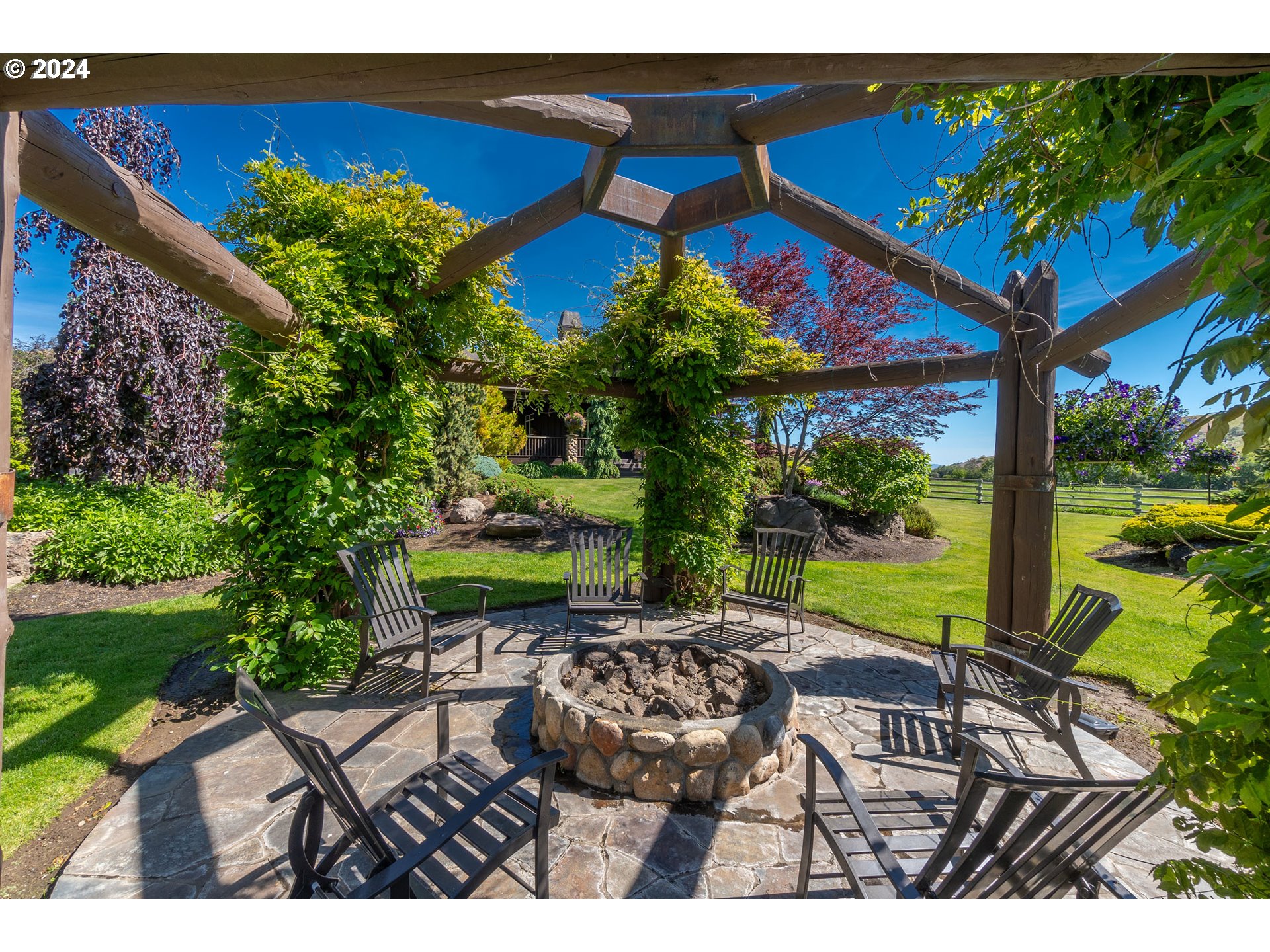 6100 Eightmile Road The Dalles, OR 97058 - Photo 40 of 44 a view of a patio with table and chairs potted plants