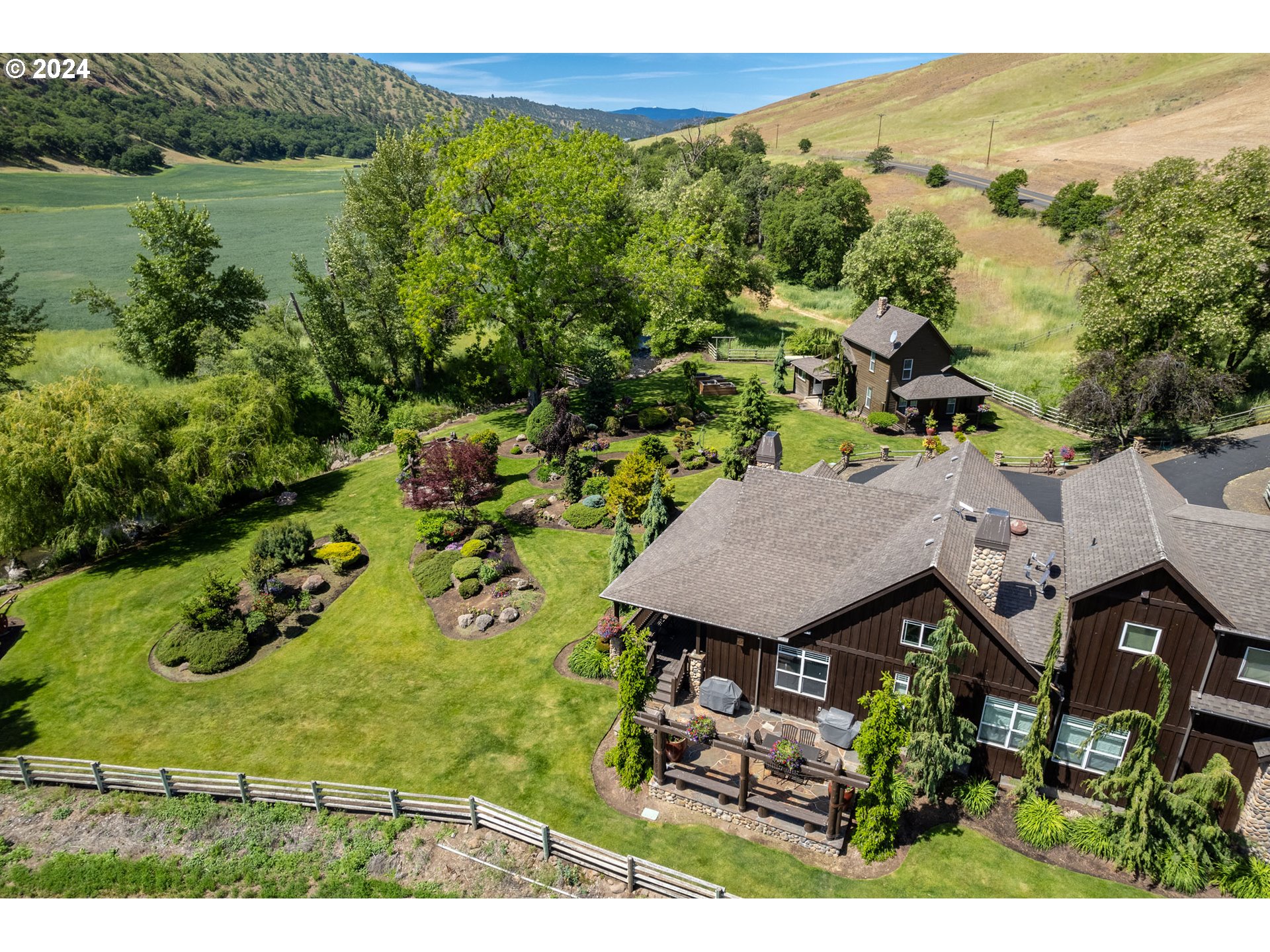 6100 Eightmile Road The Dalles, OR 97058 - Photo 6 of 44 an aerial view of a house with garden space and outdoor seating