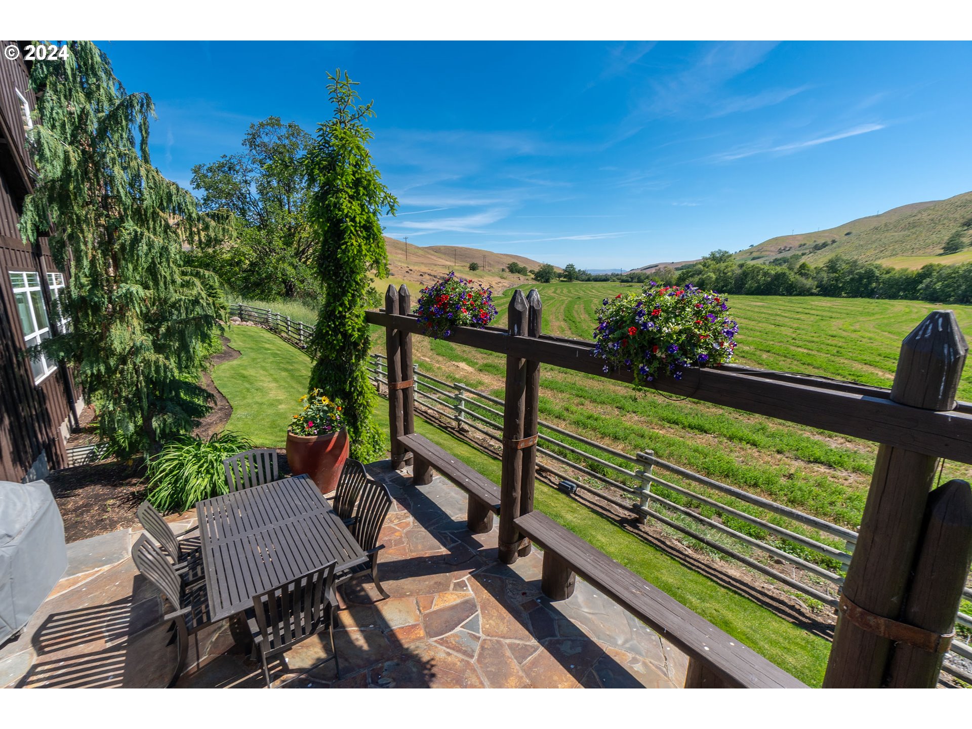 6100 Eightmile Road The Dalles, OR 97058 - Photo 9 of 44 a view of a bench in a garden