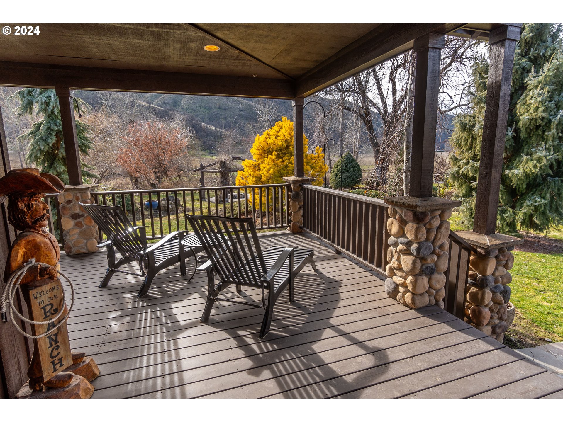 6100 Eightmile Road The Dalles, OR 97058 - Photo 10 of 44 a view of balcony with chairs and wooden floor