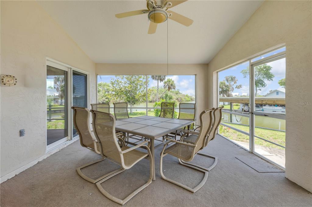 192 Azalea Road Edgewater, FL 32141 - Photo 70 of 94 a view of a dining room with furniture window and outside view