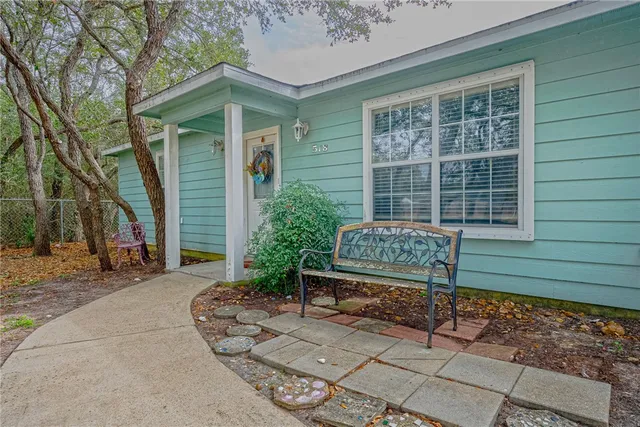 a balcony with furniture and a potted plant