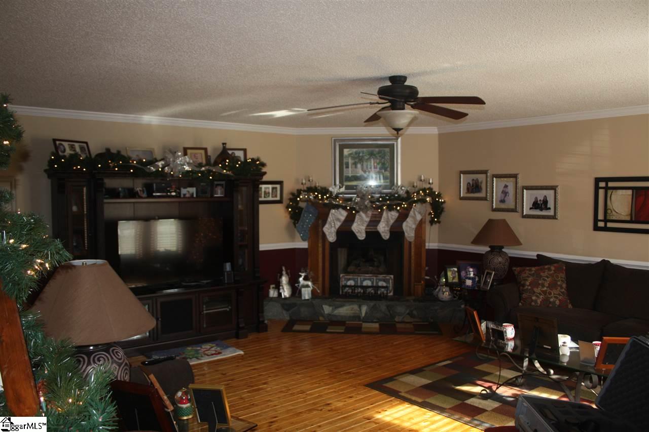 403 Wildmarsh Road Piedmont, SC 29673 - Photo 3 of 21 Living Room is very large with reclaimed Pine Flooring.