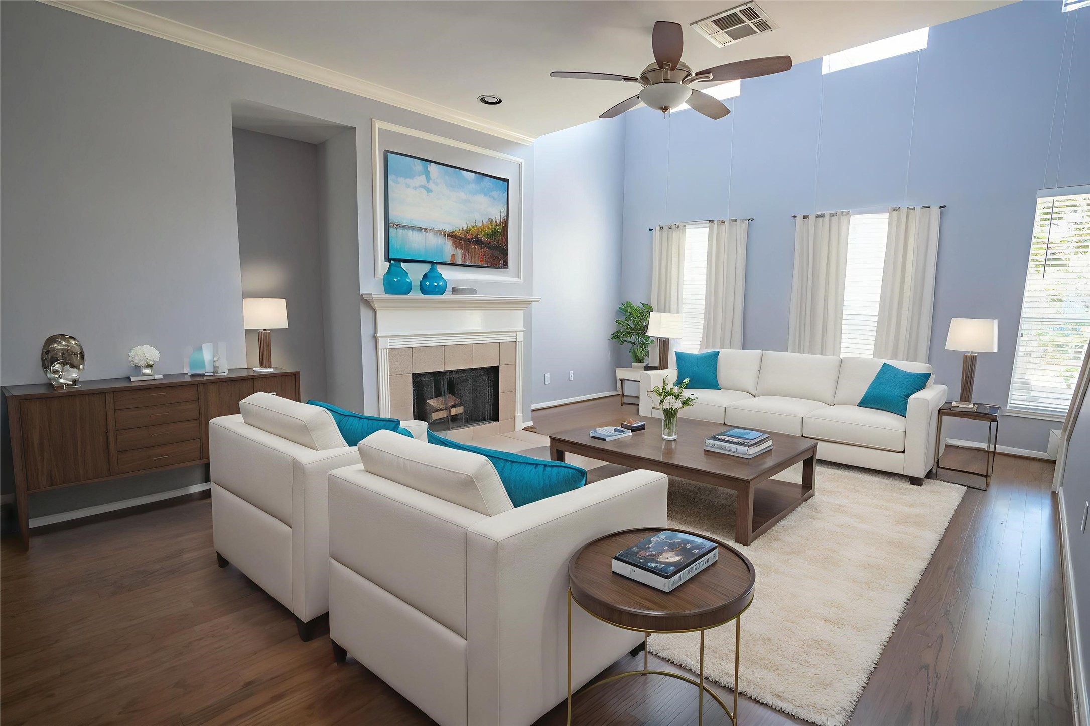 a living room with furniture a fireplace and a flat screen tv