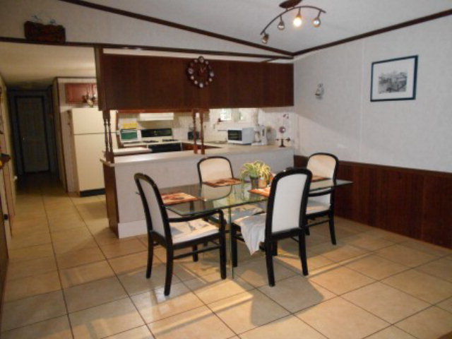 626 Tharpe Road, Unit 5A Musella, GA 31066 - Photo 3 of 9 a dining room with stainless steel appliances kitchen island granite countertop a sink and a refrigerator