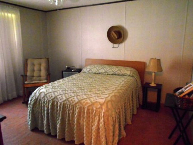 626 Tharpe Road, Unit 5A Musella, GA 31066 - Photo 7 of 9 a bedroom with a bed and cabinets