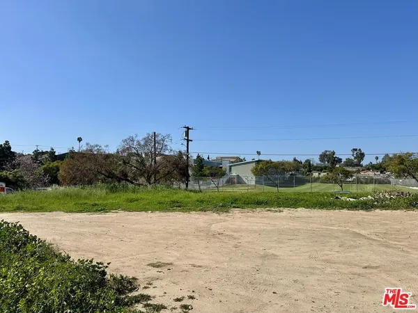 an aerial view of a houses with a yard