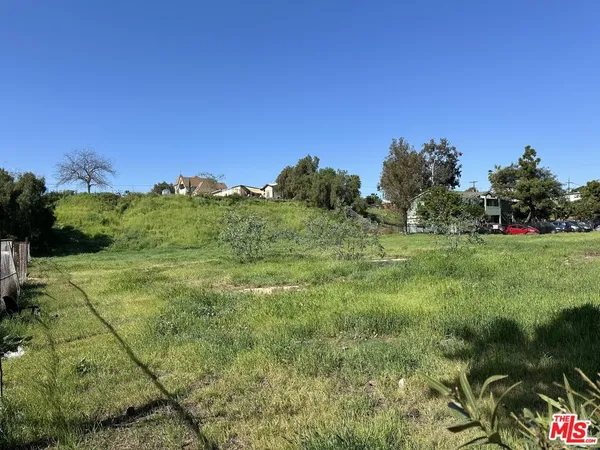 a view of a garden with houses