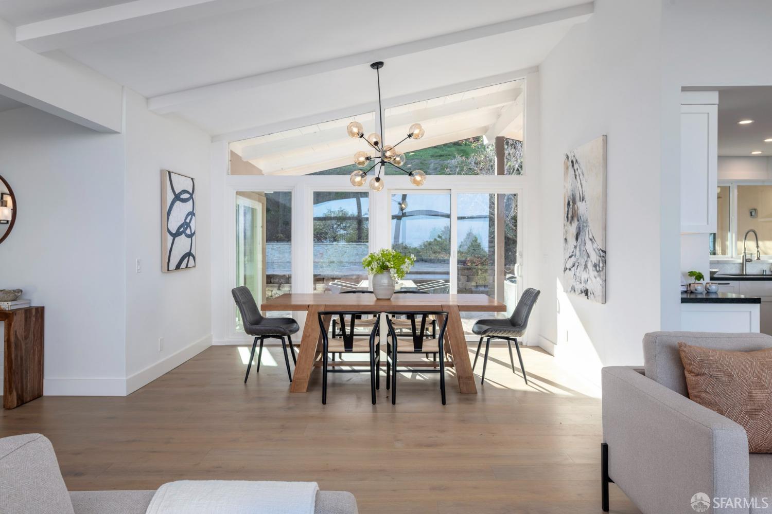 155 Brookwood Road Woodside, CA 94062 - Photo 16 of 60 a dining room with furniture a rug and a chandelier