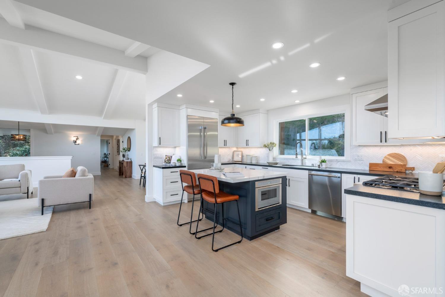 155 Brookwood Road Woodside, CA 94062 - Photo 17 of 60 a kitchen with stainless steel appliances a stove a sink dishwasher a oven with white cabinets and wooden floor
