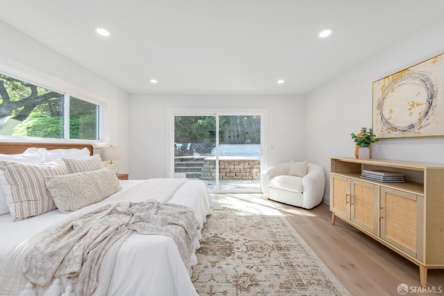 155 Brookwood Road Woodside, CA 94062 - Photo 31 of 60 a spacious bedroom with a large bed and a window