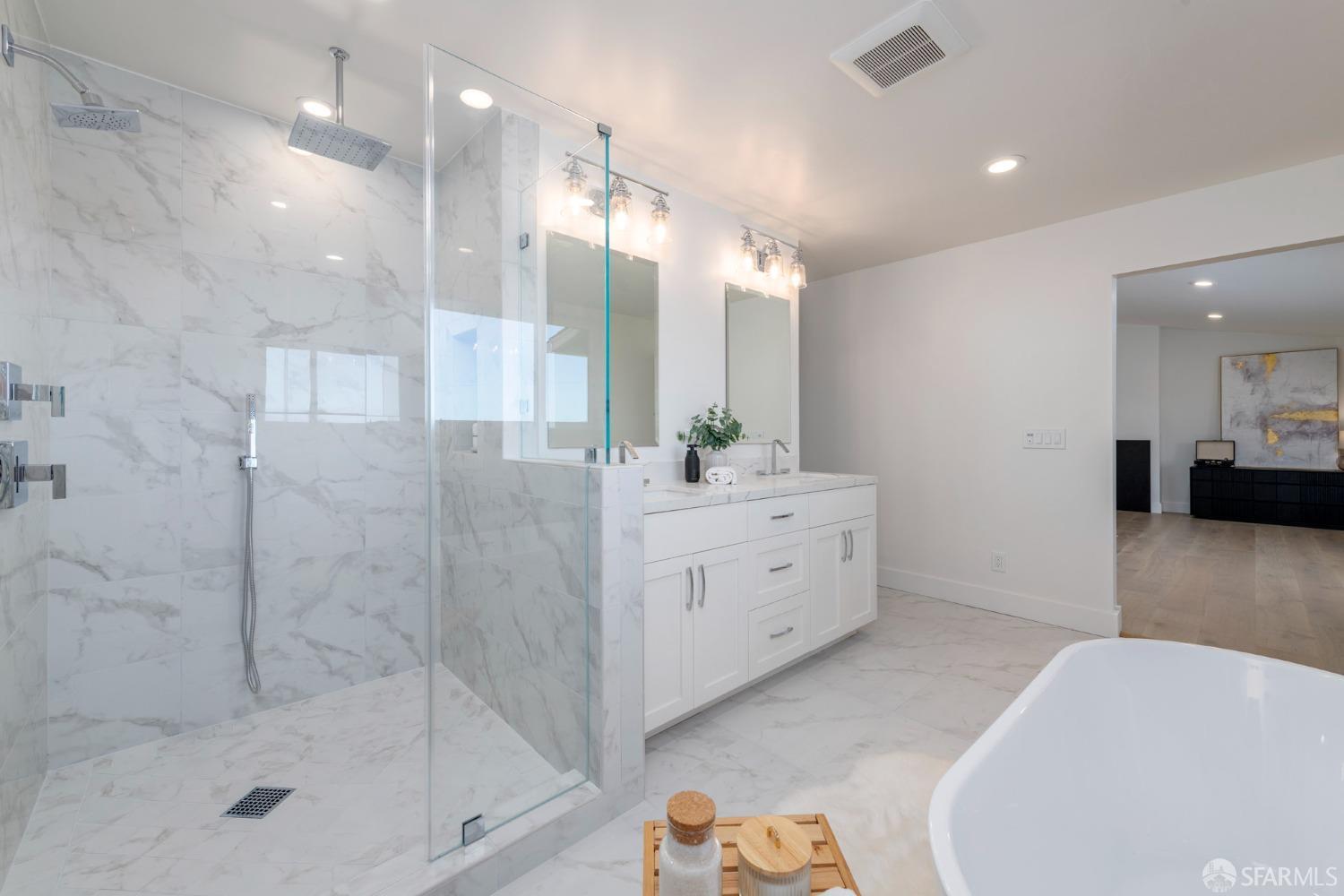 155 Brookwood Road Woodside, CA 94062 - Photo 35 of 60 a bathroom with a tub sink shower and mirror