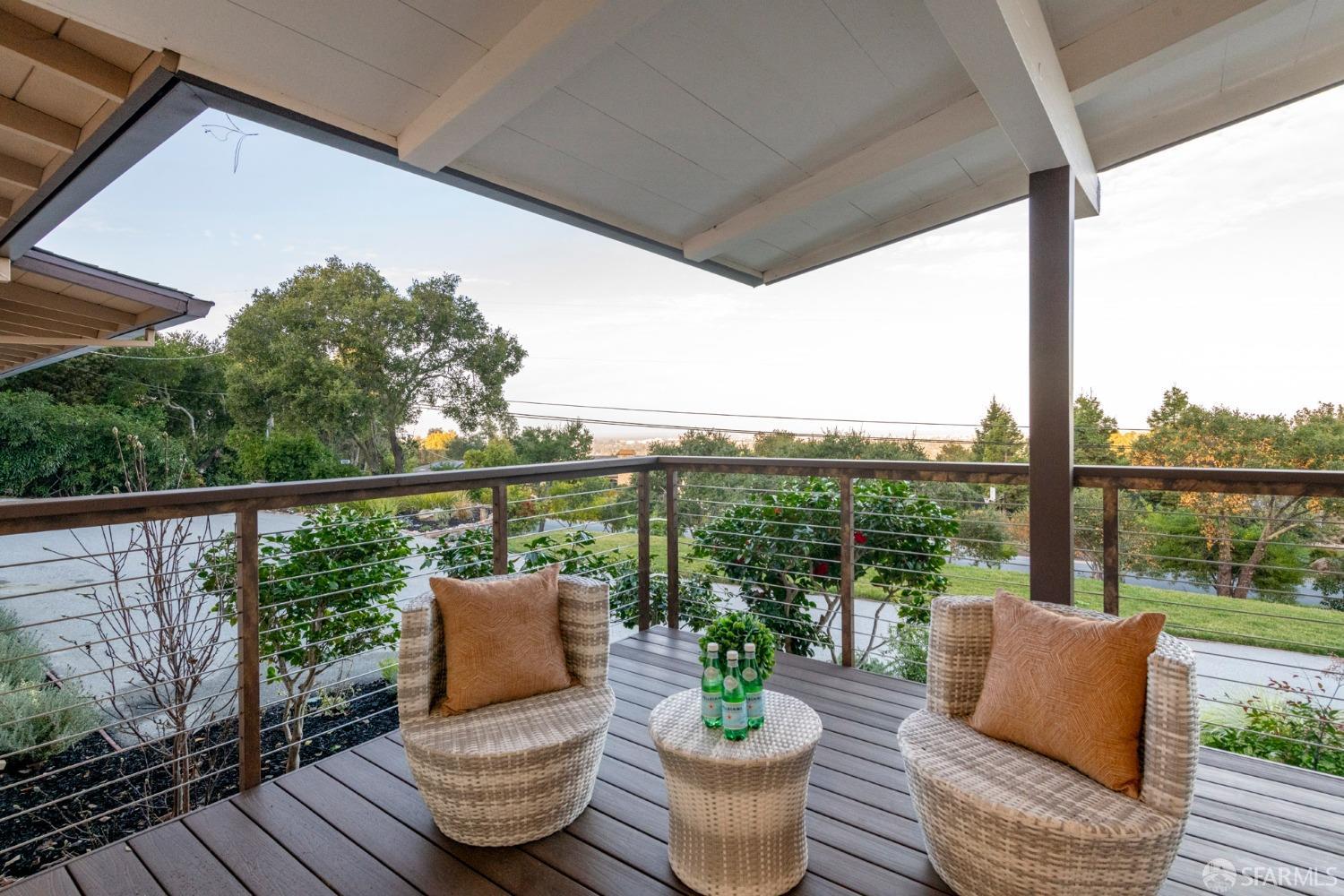 155 Brookwood Road Woodside, CA 94062 - Photo 37 of 60 a view of a deck with chairs and wooden floor